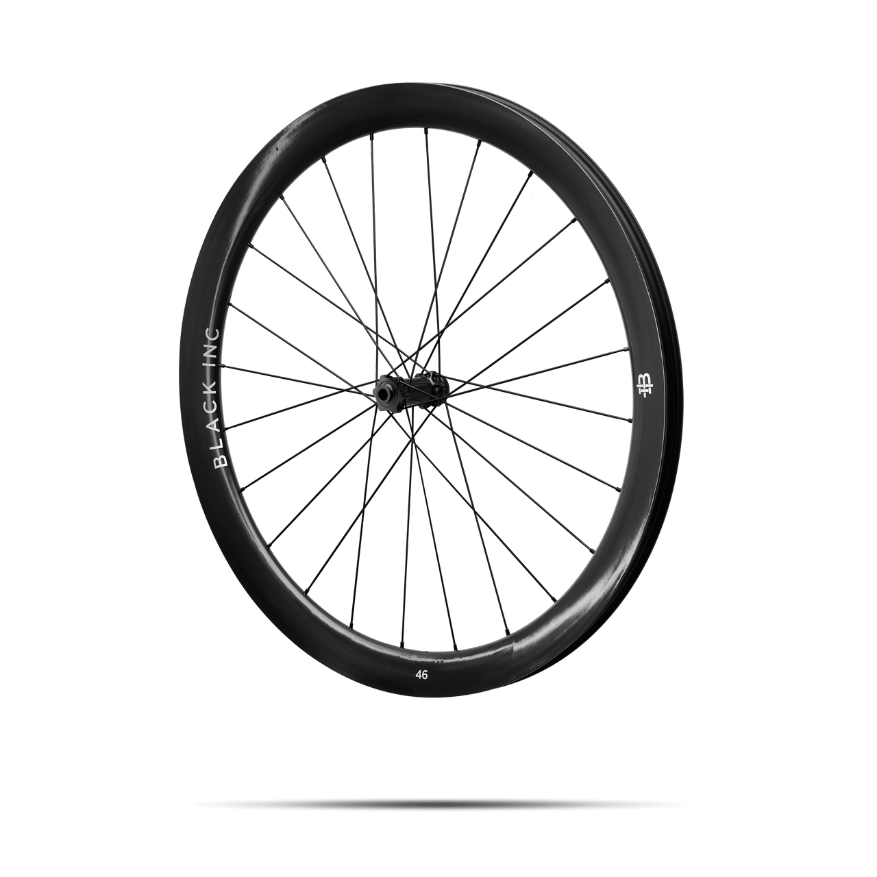 Quarter-turned side view of Black Inc FORTY SIX gravel rear wheel that appears to be floating against a transparent background.