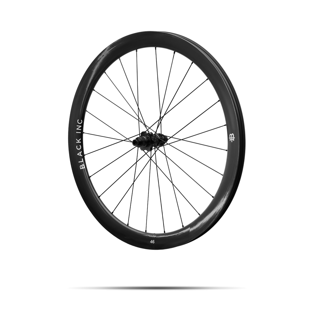 Quarter-turned side view of Black Inc FORTY SIX gravel front wheel that appears to be floating against a transparent background.